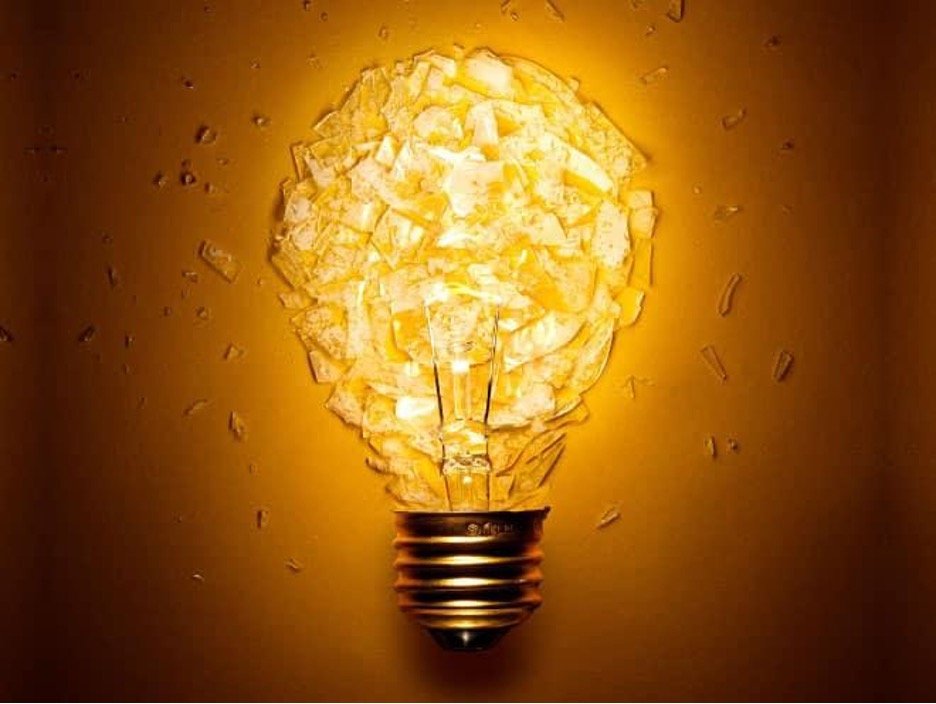 a glowing lightbulb with its glass shattered